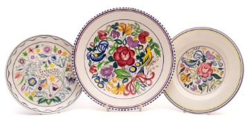 Three Poole Pottery dishes: decorated after a design by Truda Carter comprising two painted in the