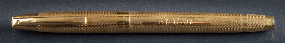 An 18ct gold engine turned 'Sheaffer' fountain pen: initialled 'A.C.