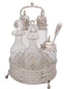 A 19th century silver circular five bottle cruet: the stand with indistinct maker's marks,