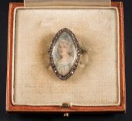 An early 19th Century gold and rose diamond marquise-shaped miniature portrait brooch: depicting a