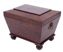 A Regency mahogany sarcophagus shaped cellarette:, with a hinged top and interior divisions,