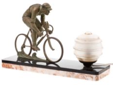 An Art Deco style bronze lamp: surmounted by a bronze racing cyclist,