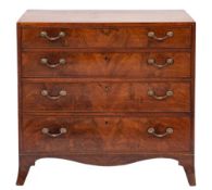 An early 19th Century mahogany and inlaid rectangular chest: the top with a chequer strung edge,