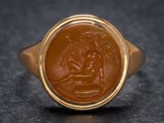 A Roman cornelian intaglio mounted seal ring: the intaglio possibly depicting the Roman god Cupid