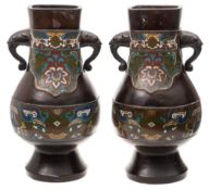 A pair of late 19th Century Chinese bronze and cloisonne vases: of ovoid form,
