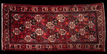 An Afghanistan rug:, the red, indigo,