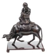 A late 17th/early 18th Century Chinese bronze figure of Lao-Tze: dressed in robes and riding on an