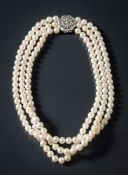 A cultured pearl three-string necklace: the cultured pearls measure an average of 6.