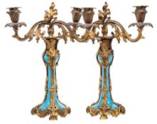 A pair of 19th Century French gilt-metal and opaque turquoise twin-branch candlesticks: with