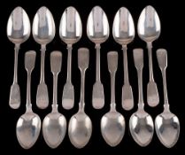 Twelve assorted William IV and later Fiddle pattern dessert spoons,