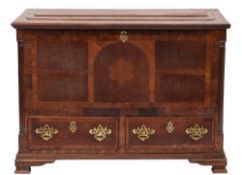 An 18th Century oak and walnut crossbanded Dower chest: the rectangular hinged top with a