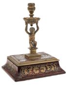 A 19th century boulle work and brass taperstick: the urn-shaped nozzle with foliate decorated drip