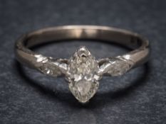 A marquise-cut diamond single-stone ring: the marquise-cut diamond approximately 7mm x 3.