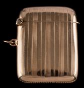 A George V 9ct gold vesta case, maker C & C??, Birmingham, 1919: of traditional rectangular outline,