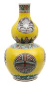 A Chinese famille jeune double gourd vase: painted with Shou and bird medallions between wave,