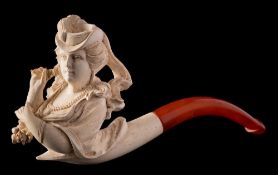 A late 19th Century carved Meerschaum pipe: the bowl in the form of an elegant woman wearing a