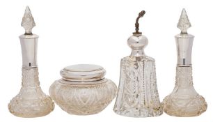 A pair of early 20th century clear cut glass and silver mounted scent bottles,
