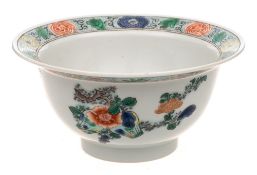 A Chinese porcelain bowl: of circular form with everted rim painted in the famille verte palette