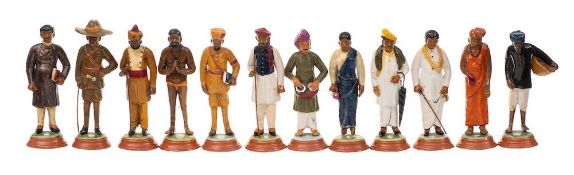 A collection of twenty four Indian plaster educational figures: including various officials,