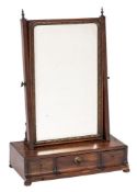 A George III mahogany swing frame platform toilet mirror: the bevelled plate within a gilt foliate