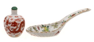 A Chinese famille rose spoon and a Chinese porcelain snuff bottle: the first painted with fruits