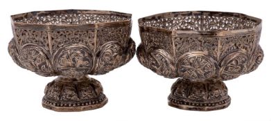 A pair of Indian silver bowls: of lobed polygonal form, with embossed decoration of figures,