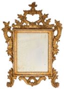 A 19th Century Continental carved giltwood mirror:, with open cartouche cresting with flowerhead,