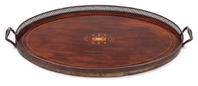 An Edwardian inlaid mahogany and sterling silver mounted galleried serving tray: of oval outline,