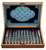 A set of twelve silver plated fish knives with twelve matching forks,