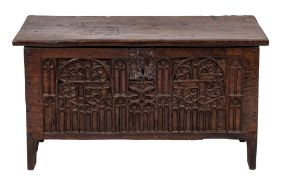 A 17th Century oak plank coffer: with a plain rectangular hinged top incised with initials 'I T',