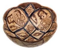 An Iranian pottery bowl: of deep circular form with lobed rim,