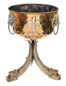A Continental brass jardiniere: the circular bowl, with half reeded decoration,