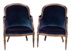 A pair of simulated rosewood tub-shaped bergere armchairs:, with upholstered backs,