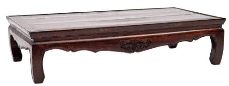 A Chinese lacquered rectangular low table:, having a shaped apron on curved legs,