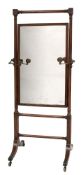 A Regency mahogany swing frame cheval mirror:,