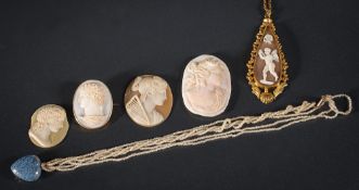 A turquoise enamelled gold heart-shaped pendant suspended from a seed-pearl necklace,