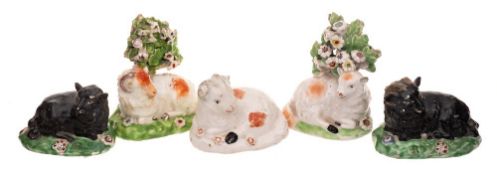 A group of five small Derby porcelain models of sheep: including two with bocage backgrounds,