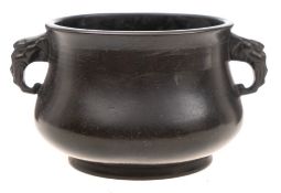 A small Chinese silver wire-inlaid bronze censer: of bombe form with dragon mask loop handles,