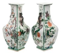 A pair of Chinese famille verte vases: of square baluster section with dragon handles,