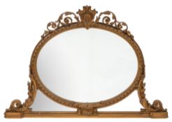 A Victorian later gilt gesso oval overmantel mirror:,