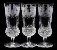 A set of twelve Edinburgh crystal flutes: of thistle shaped form with hob nail and slice cut bowls