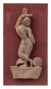 A 19th century Indian carved wood figure: of a dancing girl with ball at her feet,