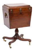 A Regency mahogany and inlaid teapoy of sarcophagus shape:, bordered with ebony lines,