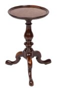 A mid 18th Century mahogany circular wine table:, with a moulded tray top,
