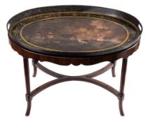 A 19th Century toleware tray: of oval outline with painted decoration of a Napoleonic naval