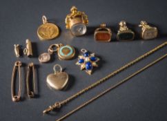 A 19th Century gold heart-shaped locket, four fob seals, a Russian five roubles gold coin,