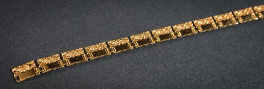 A 9ct gold rectangular panel necklace: on bolt ring clasp (some damage), together with fitted case.