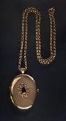 A sapphire and diamond mounted oval pendant locket stamped '9ct': on a 9ct gold belcher-link chain.