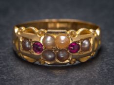 A 19th Century ruby and seed pearl eight-stone ring: approximately 3.5gms gross weight, ring size N.