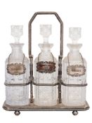 A Victorian silver plated three-division tantalus: inscribed,